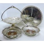 An Art Nouveau silver plated swing handle basket, a plated tray on three ball and claw feet and a