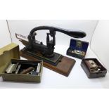 A c.1910 stapler and three razor sharpeners