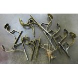 Six pairs of brass curtain pole brackets