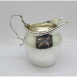 A silver cream jug by George Unite, Birmingham 1919, 89g