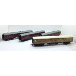 Four OO gauge railway coaches including Tri-ang and Bachmann