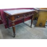 A Victorian mahogany two drawer writing table