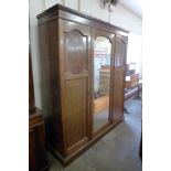 An Edward VII inlaid mahogany three door wardrobe