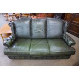 A green leather Chesterfield style settee