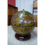A table top terrestrial globe drinks cabinet