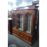 An Edward VII style inlaid mahogany side cabinet