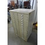 A cream metal 30 drawer index filing cabinet