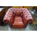 A red leather Chesterfield club armchair