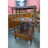 A Victorian figured walnut Canterbury whatnot