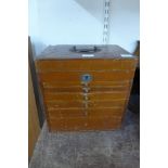 An early 20th Century mahogany table top dentist's cabinet, by C. Ash & Sons & Co. Ltd., London