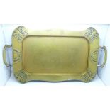 An Art Nouveau two handled brass tray, 42cm