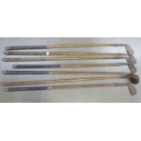 Seven hickory shafted golf clubs including Mashie made by Anderson & Sons of St. Andrews, Jiggers by