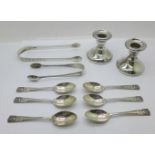 Six silver spoons, a pair of Georgian silver sugar bows, a pair of small silver candlesticks and a