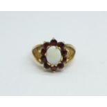A 9ct gold, opal and garnet ring, 4.3g, O