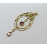 A 9ct gold articulated pendant set with almandine garnets and seed pearls, 3.6g, 45mm