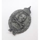 A WWI Imperial German skull and bones badge