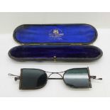 A pair of Georgian spectacles with tinted glass and a silver mounted case, Birmingham 1905