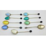 Eight silver and enamel coffee bean spoons, (6+2), and a silver thistle spoon, 72g