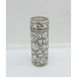 A modern silver cylindrical box with screw-top lid, decorated with intertwined flowers over a