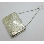 A late Victorian silver aide memoire purse, Joseph Gloster, Birmingham 1897, and a silver propelling