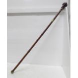 A c.1900 sword stick, with carved horn character handle and cane scabbard, blade 45.5cm