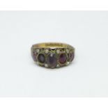 A Victorian 9ct gold ring set with red stones and seed pearls, Birmingham 1892, Solomon Henry