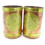 A pair of Arts and Crafts brass and copper tankards