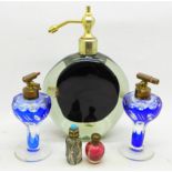 Five perfume bottles including two miniature