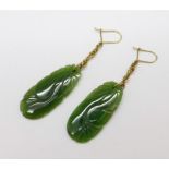 A pair of carved jade earrings, jade 16mm x 36mm