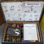 A pine trunk with a collection of early Meccano, a Meccano B key and a 1938 Meccano magazine