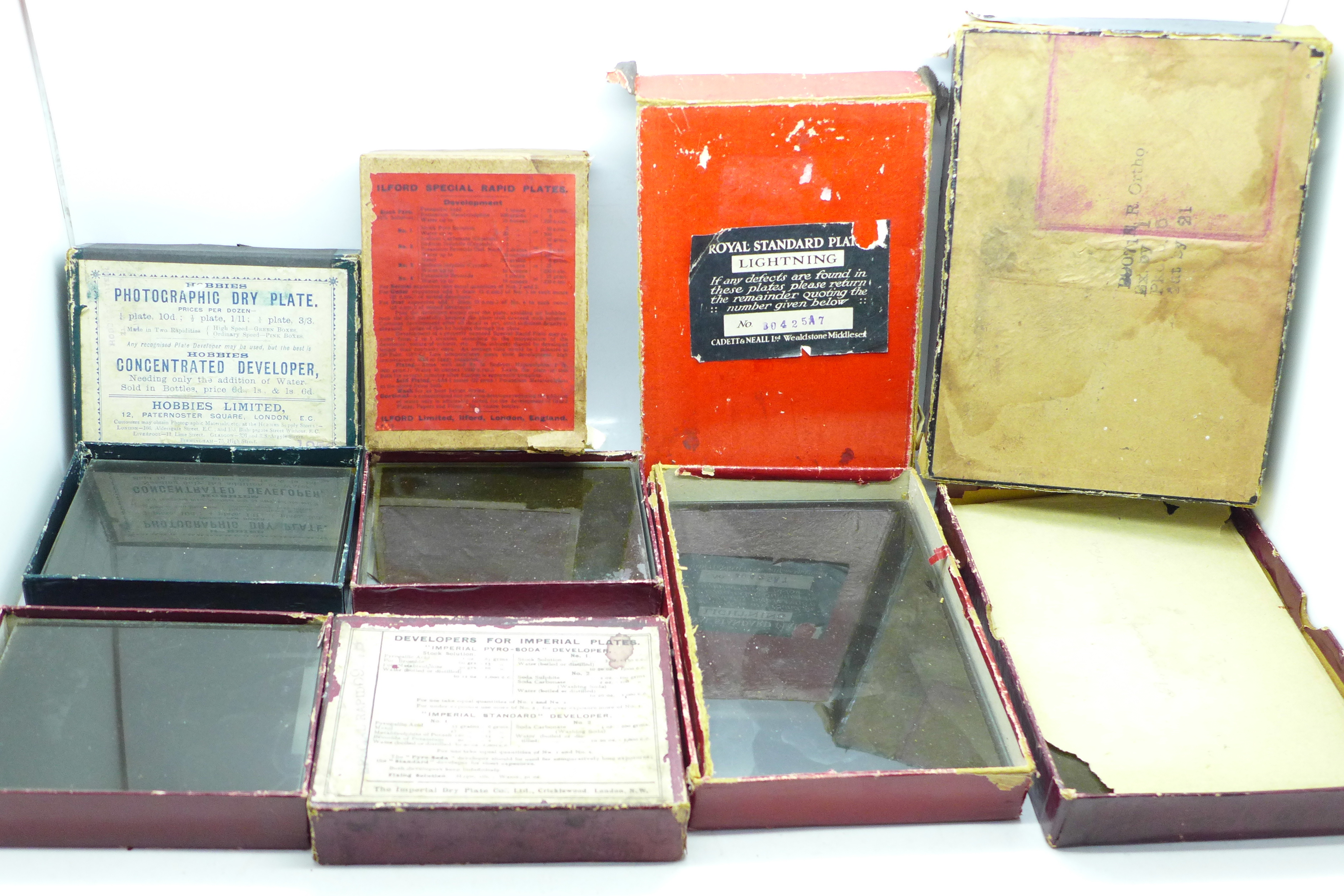 Five boxes of glass plate negatives, circa 1900 - 1940, fifty-two plates in total