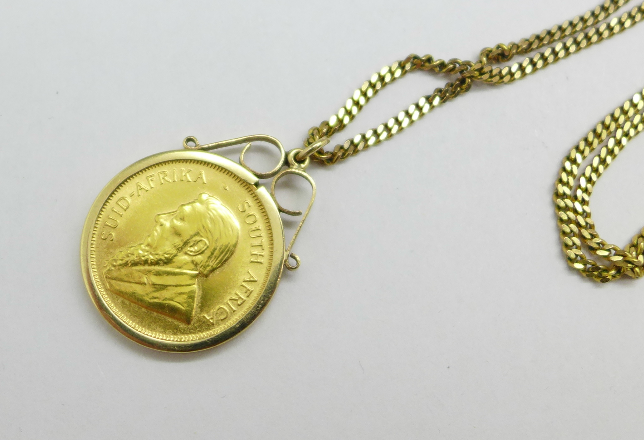 A ¼ Krugerrand, 1981, in a 9ct gold mount and on a 9ct gold chain, total weight 17.0g, chain 61cm - Image 3 of 3