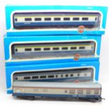 Three Airfix System 00 scale 'Inter City' coaches, boxed and a Lima coach