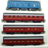 A Tri-ang Hornby OO gauge locomotive and three coaches