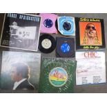 A collection of LP records and 7" 45rpm singles including Bruce Springsteen, 10cc, Gladys Knight,