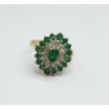 A 9ct gold, emerald and diamond cluster ring, 3.3g, O