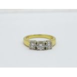 An 18ct yellow gold three stone diamond ring, approximately 1.25 carat total diamond weight, 8.6g, V