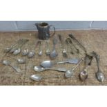 A collection of flatware and a plated jug