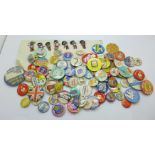A collection of badges including Robertson advertising badges