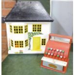 A dolls house and furniture and a vintage Codeg child's till