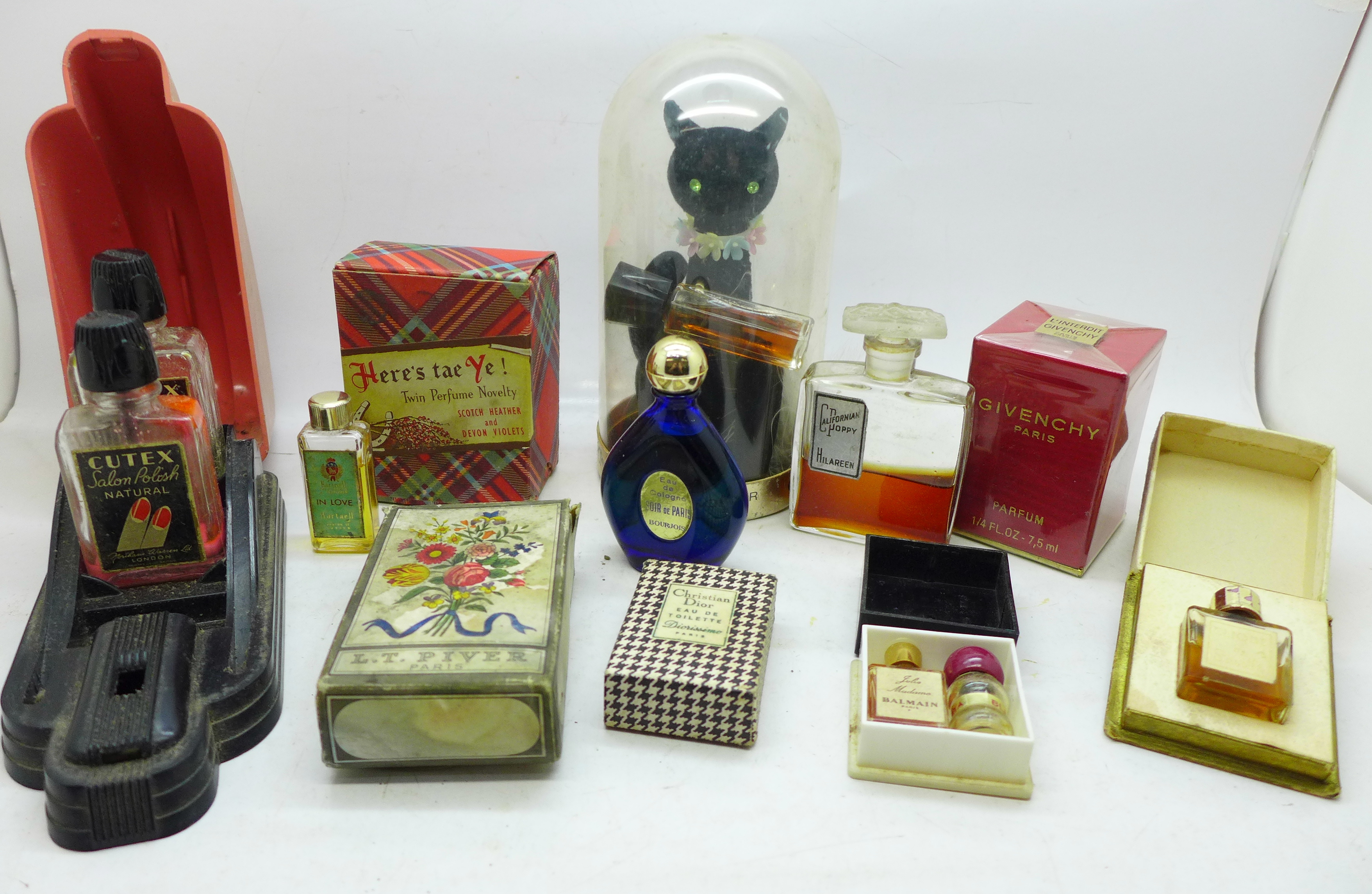 Vintage perfumes and a Bakelite stand for nail varnish and remover