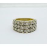 A large 18ct gold ring set with three rows of nine diamonds, 15.9g, W