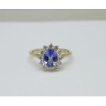 A 14ct gold, tanzanite and diamond cluster ring, with certificate, 1.25carat tanzanite and 0.