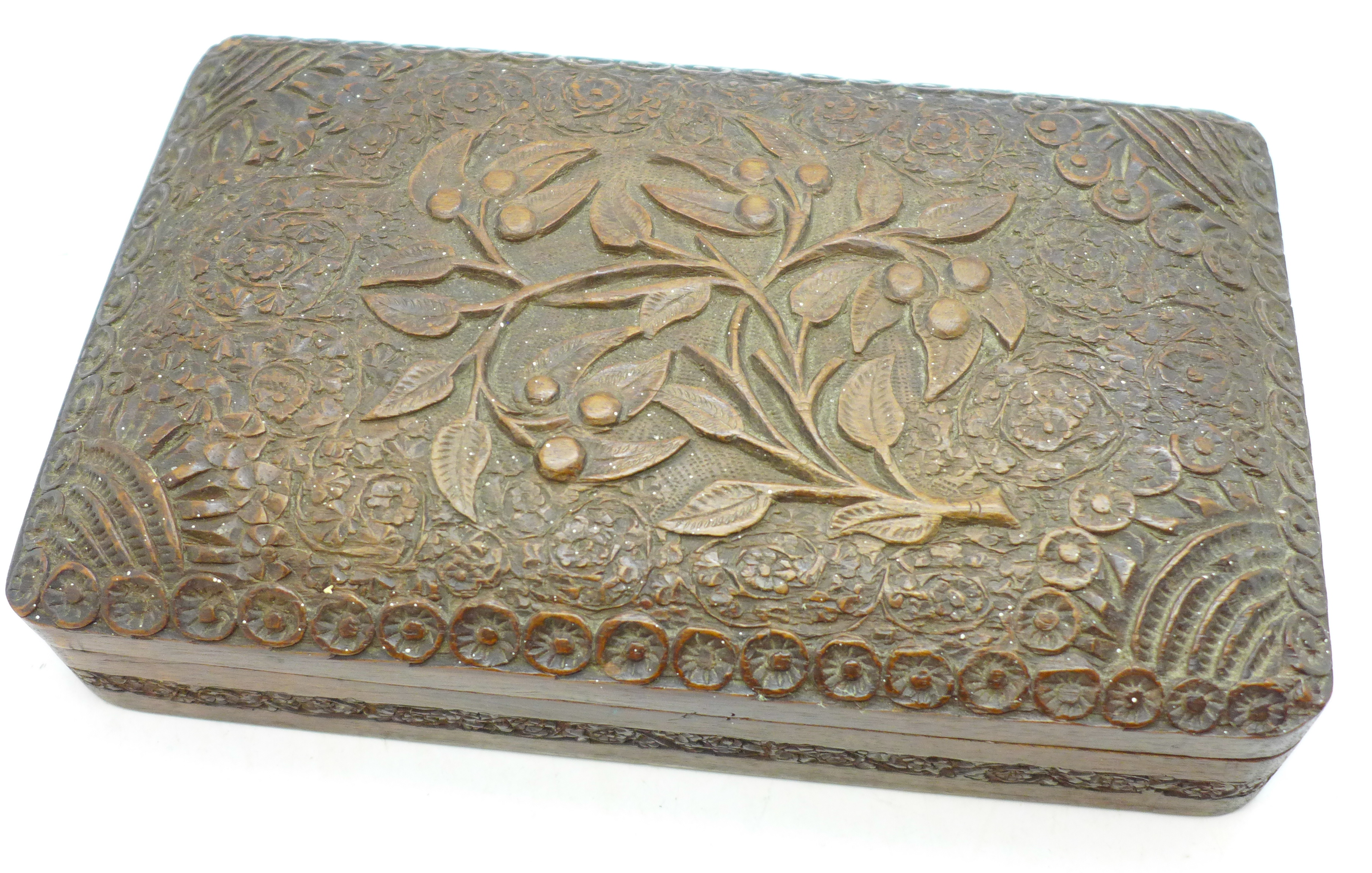 A heavily carved wooden box