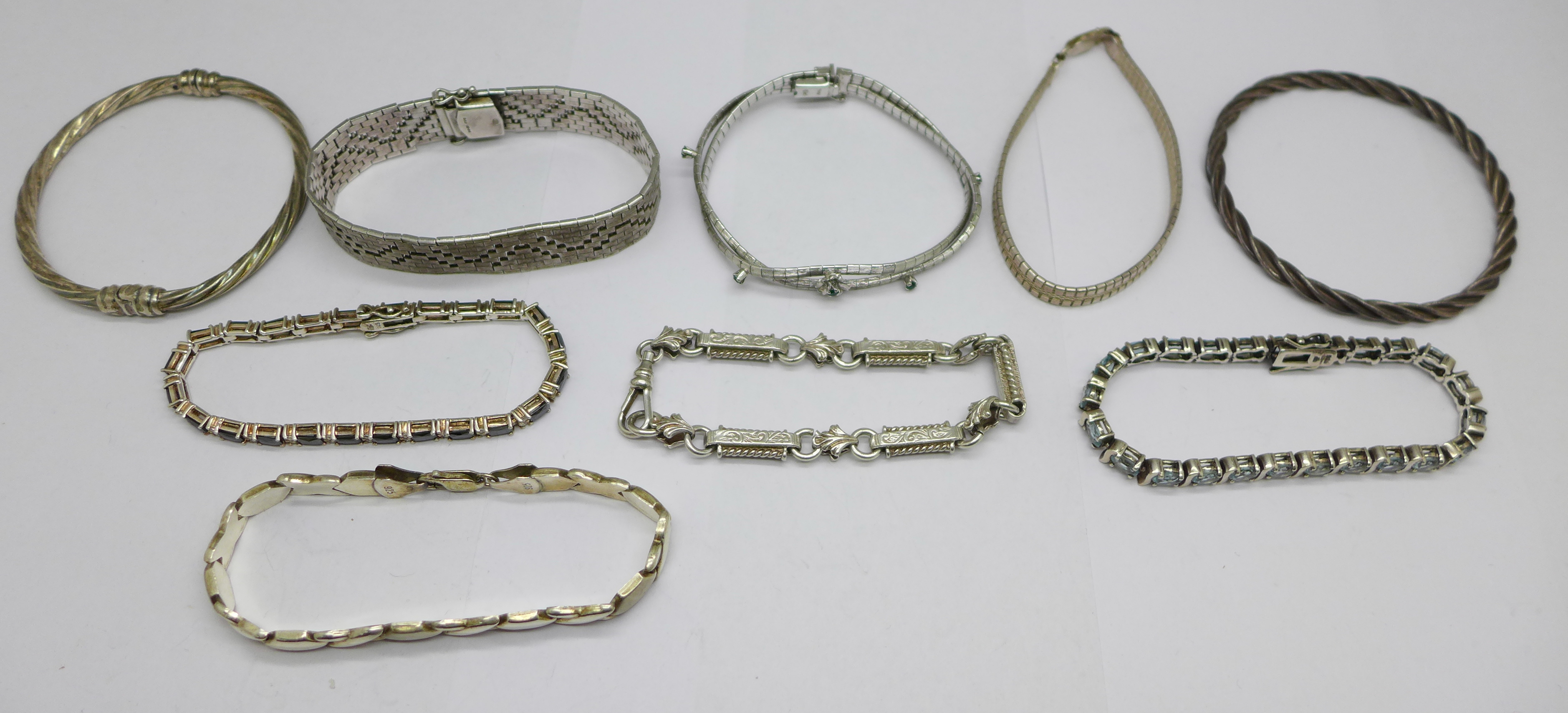 Seven silver bracelets and two silver bangles, 149g