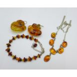 Amber coloured jewellery comprising a bracelet, earrings and a necklace