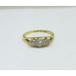 An 18ct gold and three stone diamond ring, 3.9g, Q