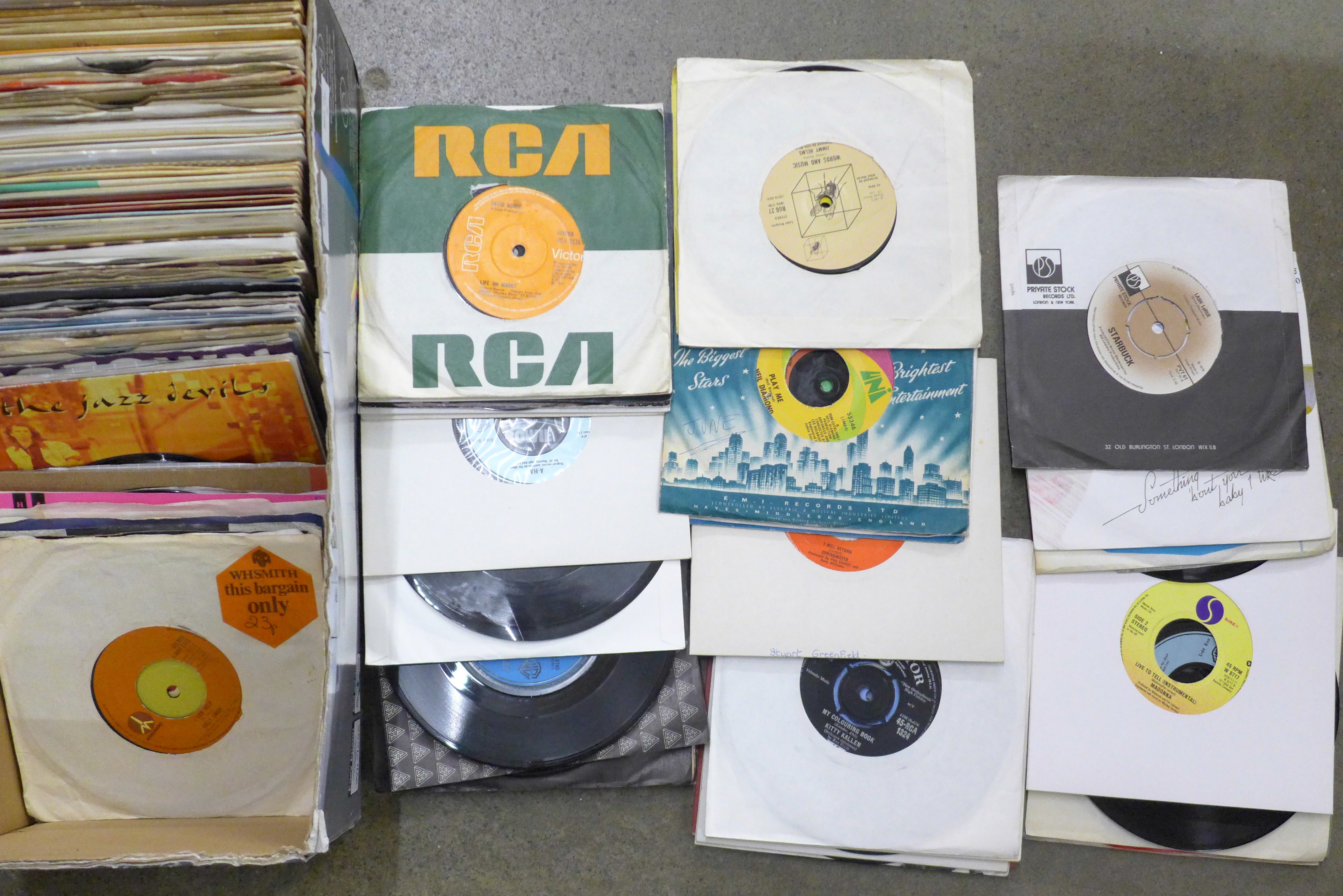 A box of 45rpm 7" vinyl singles