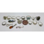 Ten silver rings, four silver pendants, a silver locket, a pair of silver earrings and two plated