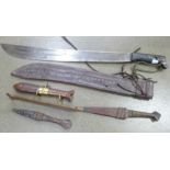 A machete, blade 56cm, a fish carving set and two other knives